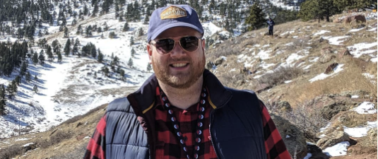Travis hiking in the Rocky Mountains.